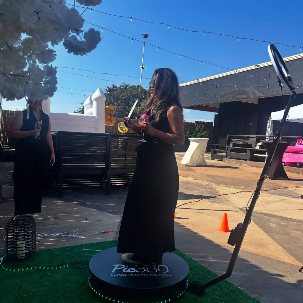 Guest using the Pic360 platform at an outdoor event setup